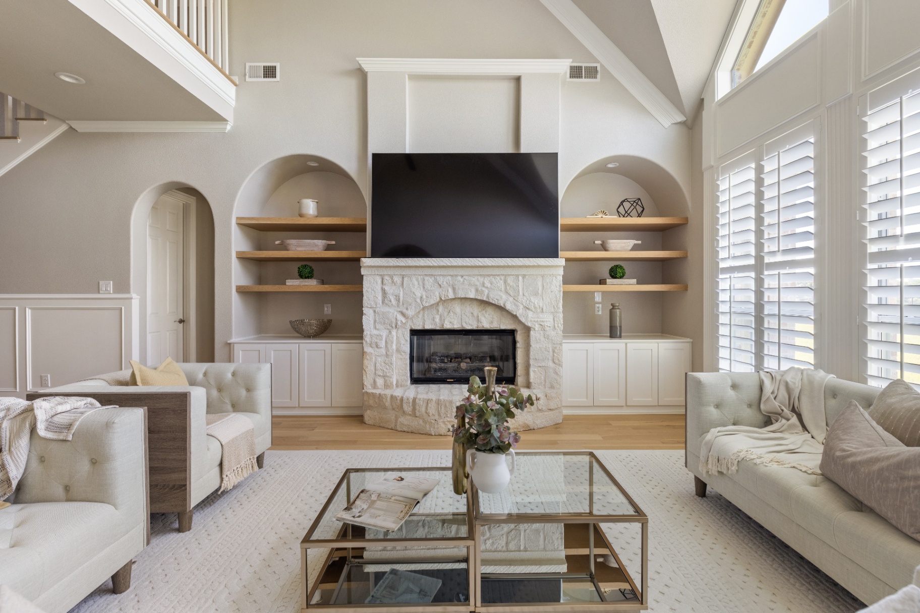 Living room with stone fireplace and built-ins