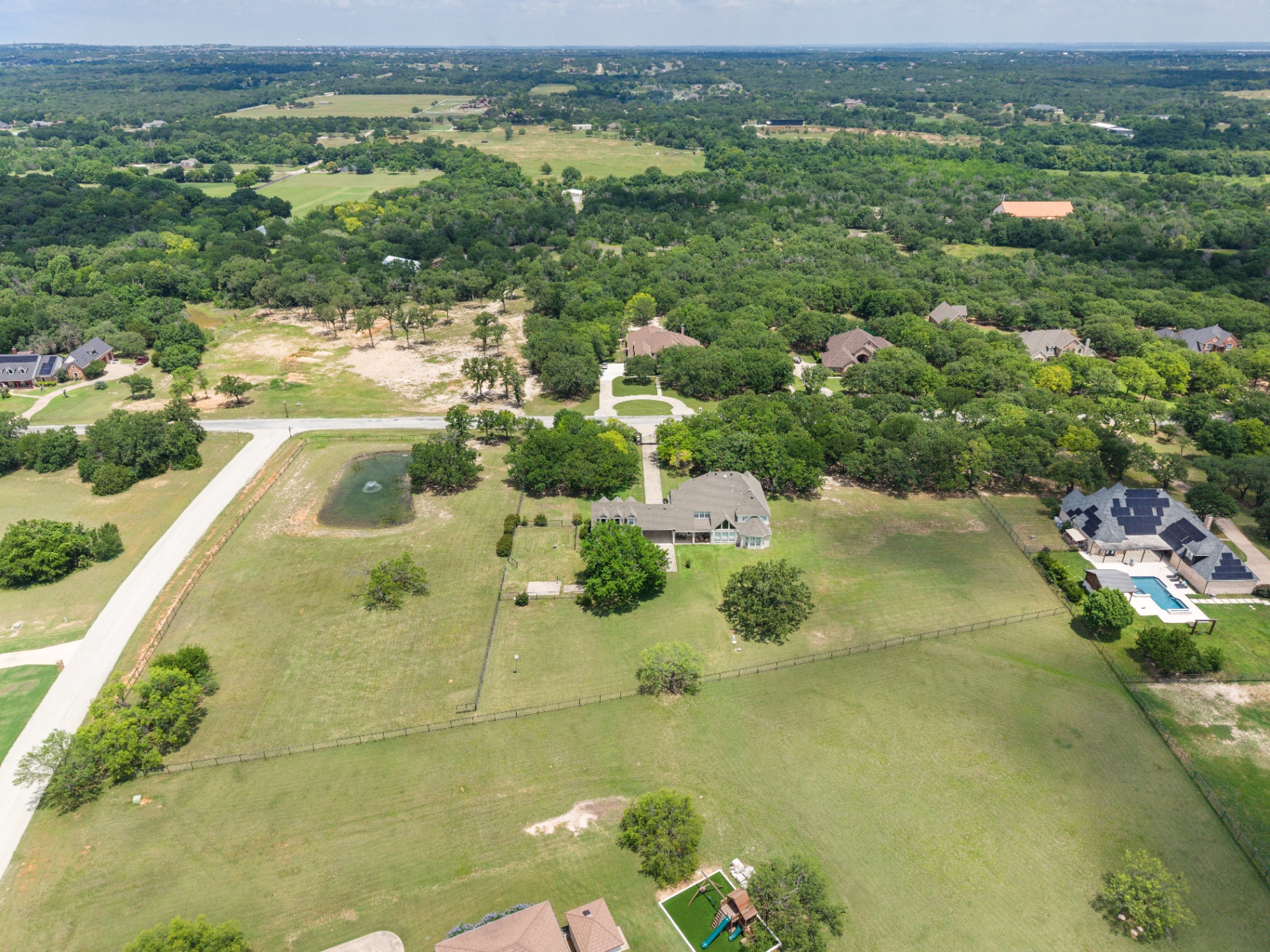 Aerial of rear elevation and pasture